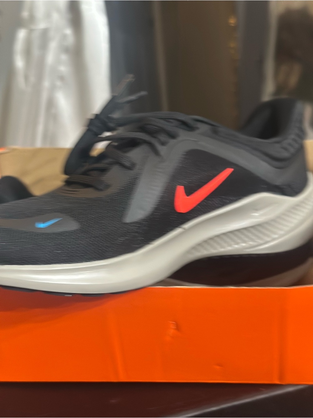 Nike Black Sneaker with Red Swoosh and Blue Accent